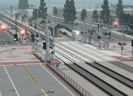 Simulated train station with tracks, platforms, and traffic lights.